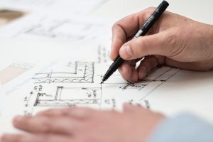 man-drawing-blueprint