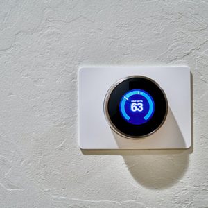 Digital-thermostat-on-white-wall